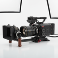 High-end 4K video camera with lens on white background